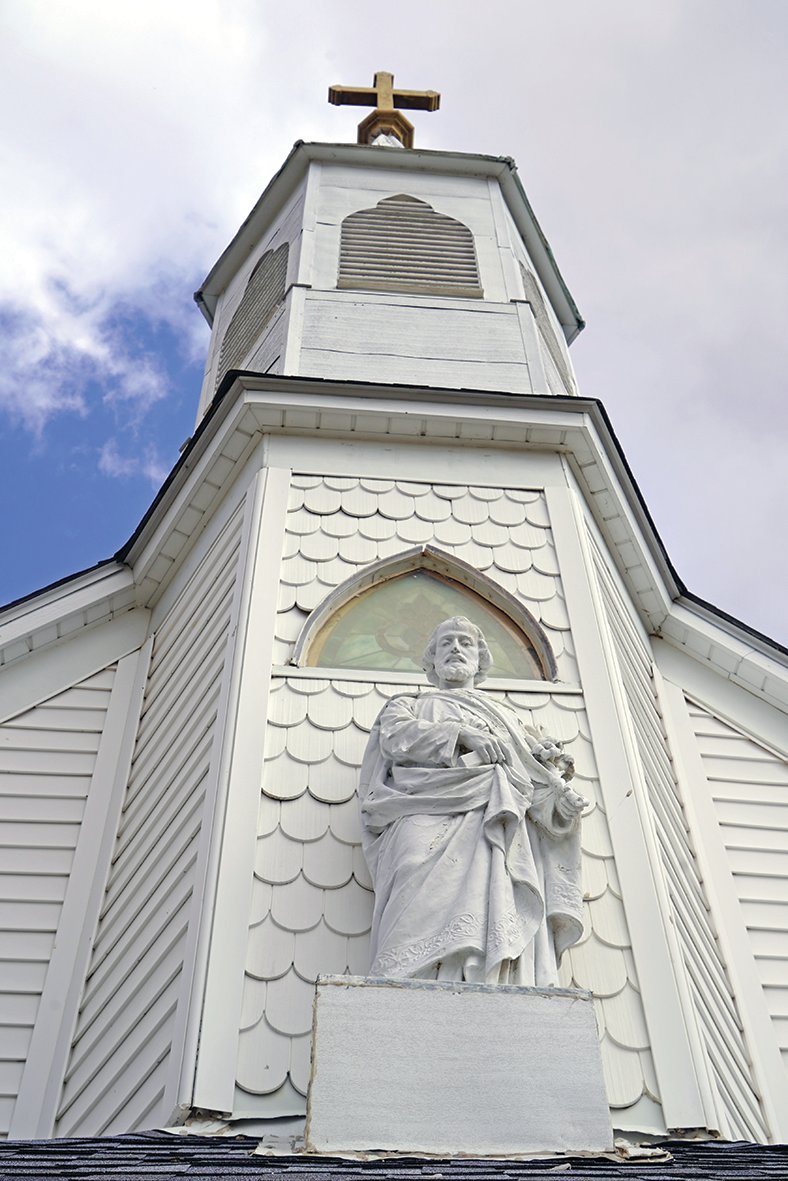 Statue of St. Joseph and the child Jesus, over the entrance to St. Joseph Church at Hurricane Branch.